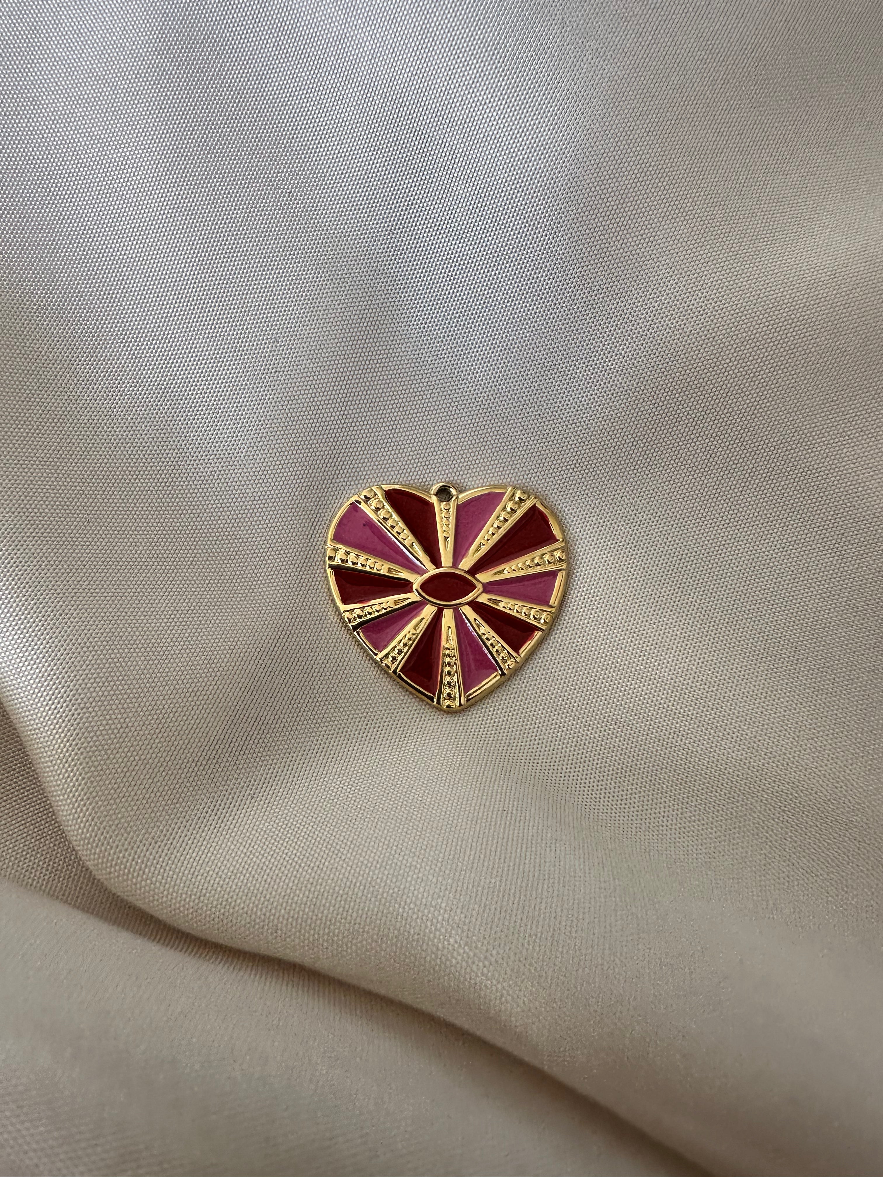 Charm coeur rayon rouge